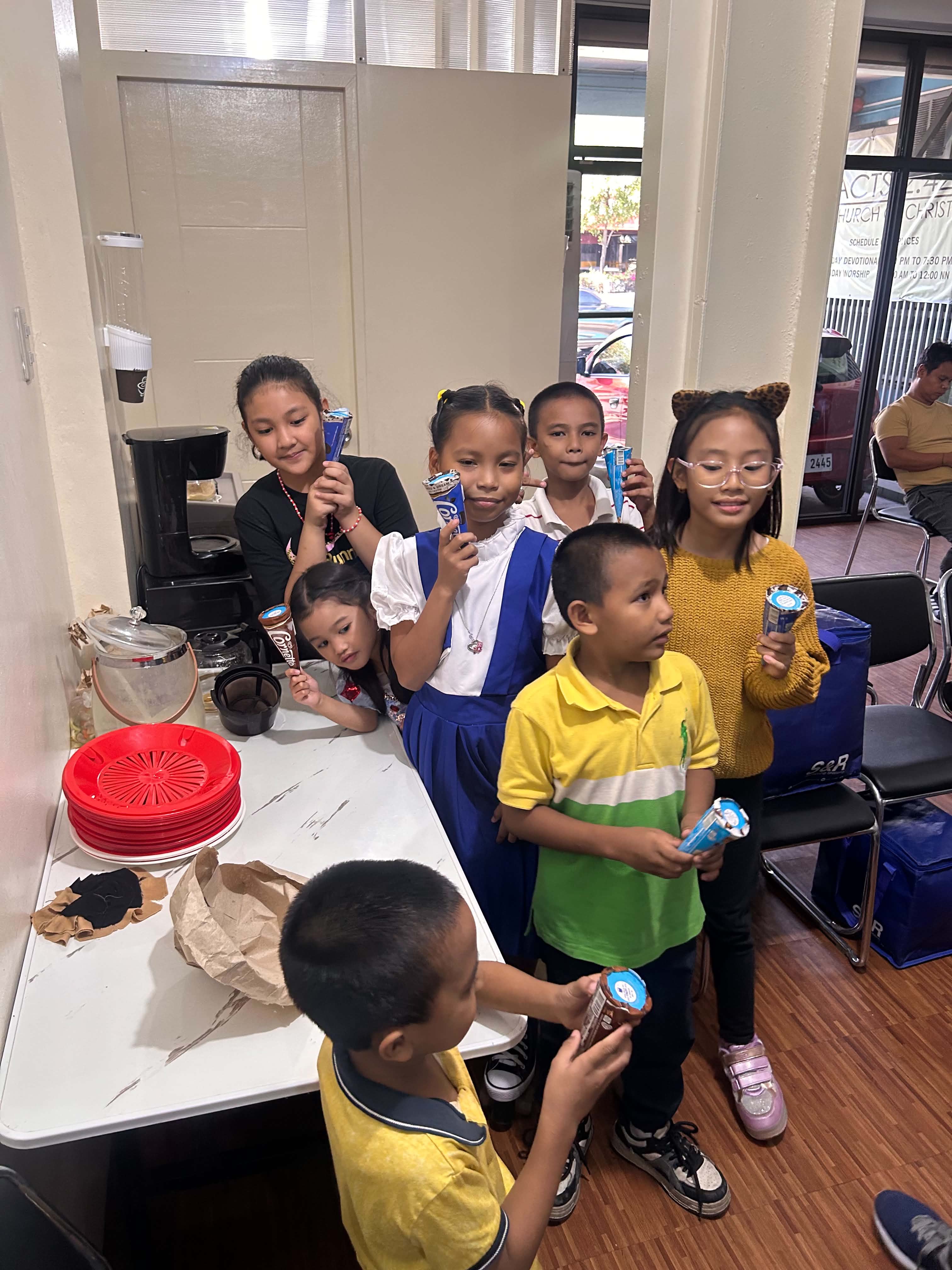 Kids picking up their ice cream at the counter