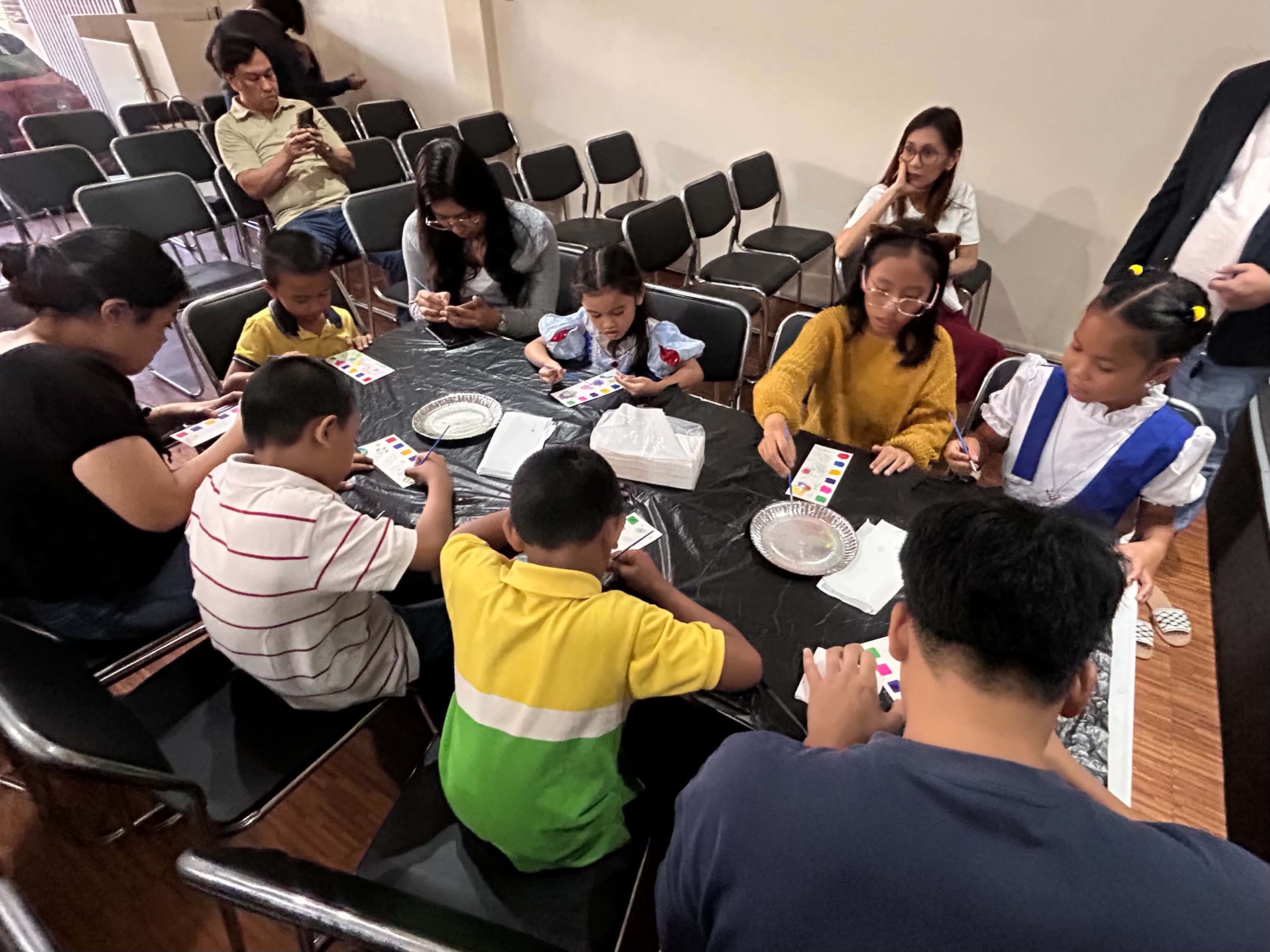 Wider view of the painting activity in progress